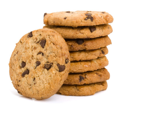 Pile of chocolate chip cookies isolated on white background